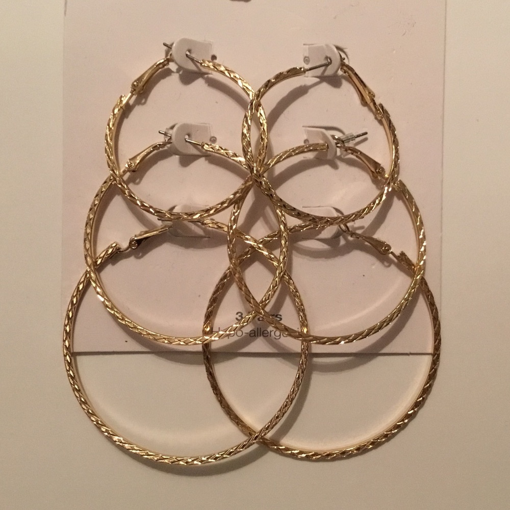 Time and Tru Hypo-allergenic 3 Pairs of gold tone hoops.